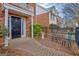 Charming brick townhome featuring a manicured front yard and walkway, inviting curb appeal at 498 N Jeff Davis Dr, Fayetteville, GA 30214