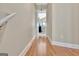 Bright hallway with hardwood floors leading into bedroom, showcasing a clean and inviting transition at 498 N Jeff Davis Dr, Fayetteville, GA 30214