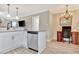 Well-designed kitchen with stainless steel dishwasher, open to a charming office space at 498 N Jeff Davis Dr, Fayetteville, GA 30214