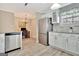 Modern kitchen featuring stainless steel appliances, stylish cabinetry, and view into an office at 498 N Jeff Davis Dr, Fayetteville, GA 30214