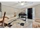 Bright living room with piano, modern furnishings, and views into the kitchen at 498 N Jeff Davis Dr, Fayetteville, GA 30214