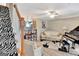 Open-concept living room featuring modern design, stylish staircase, and access to the kitchen at 498 N Jeff Davis Dr, Fayetteville, GA 30214