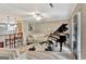 Bright living room with piano, modern furnishings, and views into the kitchen at 498 N Jeff Davis Dr, Fayetteville, GA 30214