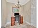 Bright office space with a classic desk, chandelier, and elegant decor at 498 N Jeff Davis Dr, Fayetteville, GA 30214