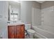 Bathroom with vanity, toilet, and shower-tub combo at 1915 Grove Way, Hampton, GA 30228