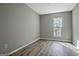 Bedroom featuring gray walls and new flooring at 1915 Grove Way, Hampton, GA 30228