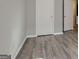 Bedroom showcasing sleek gray walls, modern vinyl floors, and white doors at 1915 Grove Way, Hampton, GA 30228