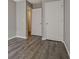 Bedroom featuring white doors and new flooring at 1915 Grove Way, Hampton, GA 30228