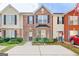 Charming brick townhouse with black shutters and neatly landscaped front yard at 1915 Grove Way, Hampton, GA 30228