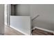 Hallway with light wood flooring and white trim at 1915 Grove Way, Hampton, GA 30228