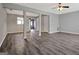 Spacious open-concept living room with new flooring and a ceiling fan at 1915 Grove Way, Hampton, GA 30228