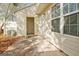 Rear patio with concrete, siding, windows, and a door that leads to the interior at 1915 Grove Way, Hampton, GA 30228
