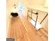 Attic with a wooden floor, railing, and a rocking chair at 304 Chestatee Ct, Woodstock, GA 30188