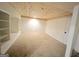 Spacious basement with built-in shelving and carpeted floors with a wood plank ceiling at 304 Chestatee Ct, Woodstock, GA 30188