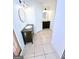 Bathroom featuring double sink vanities with tile flooring and modern light fixtures at 304 Chestatee Ct, Woodstock, GA 30188