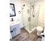 Bathroom with glass enclosed shower, tile flooring, gray vanity, and modern fixtures at 304 Chestatee Ct, Woodstock, GA 30188