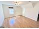 A bedroom featuring hardwood floors, a window, and neutral wall paint at 304 Chestatee Ct, Woodstock, GA 30188