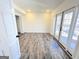 Large room with french doors and vinyl flooring at 304 Chestatee Ct, Woodstock, GA 30188