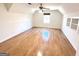 A bedroom with hardwood floors, a window, and recessed shelving at 304 Chestatee Ct, Woodstock, GA 30188