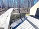 A large gray deck extends to the front door of this home, as well as the driveway at 304 Chestatee Ct, Woodstock, GA 30188