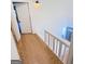 Bright hallway features hardwood floors, white walls and a hall light at 304 Chestatee Ct, Woodstock, GA 30188