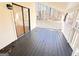 Covered back patio with black painted floor, sliding glass doors and wooded views at 304 Chestatee Ct, Woodstock, GA 30188