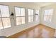 Sunroom featuring light hardwood floors and windows with wooded scenery at 304 Chestatee Ct, Woodstock, GA 30188