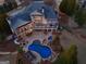 Expansive aerial view of the property showcasing the pool, patio, lush landscaping, and well-maintained grounds at 300 Annelise Park Dr, Fayetteville, GA 30214