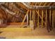 Exposed rafters, beams and duct work in this unfinished attic at 300 Annelise Park Dr, Fayetteville, GA 30214