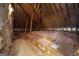 Spacious attic with exposed beams filled with insulation, showing ample storage and energy efficiency at 300 Annelise Park Dr, Fayetteville, GA 30214