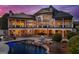 Stunning backyard featuring a large pool, hot tub, outdoor kitchen, and a spacious patio with ample seating at 300 Annelise Park Dr, Fayetteville, GA 30214