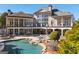 Expansive backyard featuring a pool, outdoor seating, and manicured landscaping at 300 Annelise Park Dr, Fayetteville, GA 30214