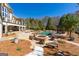 Expansive backyard featuring a sparkling pool, cozy fire pit, and luxurious outdoor amenities at 300 Annelise Park Dr, Fayetteville, GA 30214