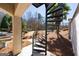 Outdoor spiral staircase enhances backyard access with lush landscape views, near a covered patio at 300 Annelise Park Dr, Fayetteville, GA 30214