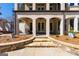 Stunning backyard features stone steps, spacious patio, and seamless indoor-outdoor living at 300 Annelise Park Dr, Fayetteville, GA 30214