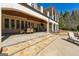 Impressive backyard view showcasing stone steps, spacious patio, outdoor seating, and lush greenery at 300 Annelise Park Dr, Fayetteville, GA 30214