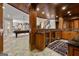 The basement wet bar features custom cabinetry, granite countertops, and stainless steel appliances at 300 Annelise Park Dr, Fayetteville, GA 30214