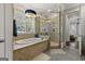 Bright bathroom with a separate shower and tub, tiled floors and walls, and a window with blinds at 300 Annelise Park Dr, Fayetteville, GA 30214