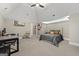Spacious bedroom features a vaulted ceiling, ceiling fan, and desk area at 300 Annelise Park Dr, Fayetteville, GA 30214