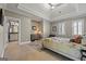This primary bedroom features a tray ceiling and an ensuite bathroom at 300 Annelise Park Dr, Fayetteville, GA 30214