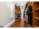 Walk-in closet with custom wood shelving and hanging rods for clothing storage at 300 Annelise Park Dr, Fayetteville, GA 30214