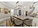 Beautiful dining room with a stone table, chandelier, and views into the home's entryway at 300 Annelise Park Dr, Fayetteville, GA 30214