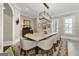 Formal dining room with modern chandelier and large table for large gatherings at 300 Annelise Park Dr, Fayetteville, GA 30214