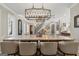 Dining room showcasing a long, neutral toned table beneath a contemporary light fixture at 300 Annelise Park Dr, Fayetteville, GA 30214