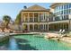 Elegant home with a pristine pool, stone accents, and a serene outdoor living space at 300 Annelise Park Dr, Fayetteville, GA 30214
