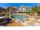Expansive home exterior featuring a pool and patio area at 300 Annelise Park Dr, Fayetteville, GA 30214