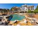 Expansive home exterior featuring a pool and patio area at 300 Annelise Park Dr, Fayetteville, GA 30214