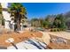 Scenic view of backyard featuring a pool, patio, pergola, and lush landscaping at 300 Annelise Park Dr, Fayetteville, GA 30214