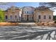 Beautifully designed home with classic architectural details, a columned entrance, and a paved driveway at 300 Annelise Park Dr, Fayetteville, GA 30214