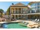 Backyard oasis with a large pool, an outdoor firepit, and an elegantly styled home at 300 Annelise Park Dr, Fayetteville, GA 30214